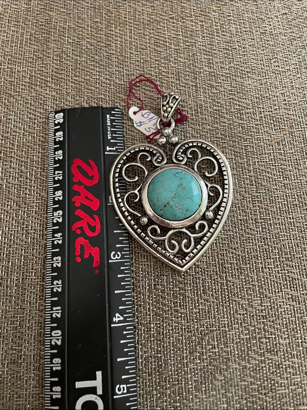 Fancy Lg Silvertone pendant with turquoise Center stone (faux)